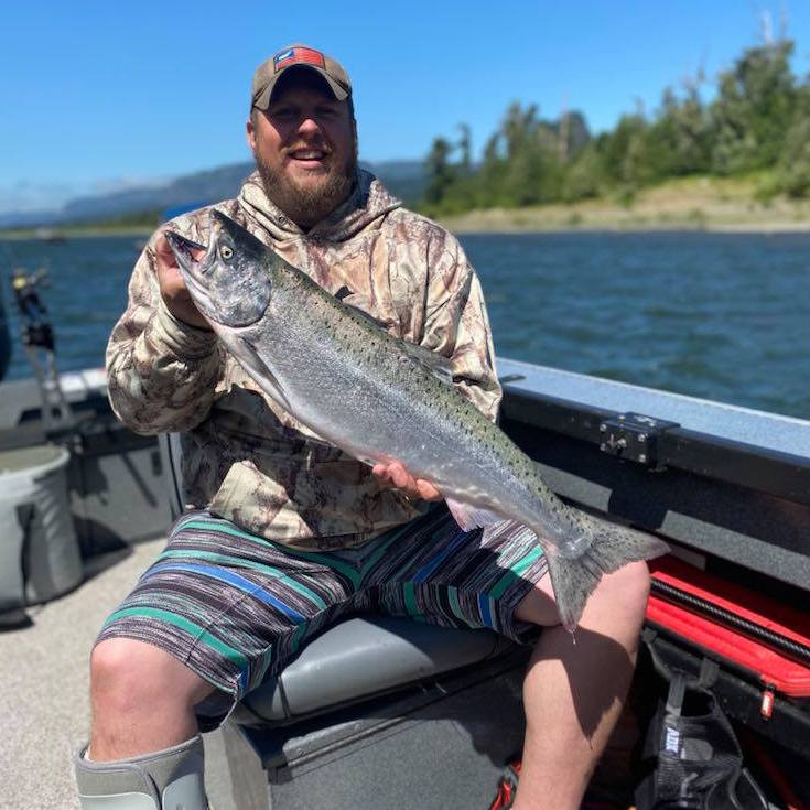 Family posing on the dock with a haul of freshly caught Chinook salmon and Dungeness crab after a successful guided combo trip in Oregon—Adventures with Mayhem Outfitters Fishing and Cabbing guided trip